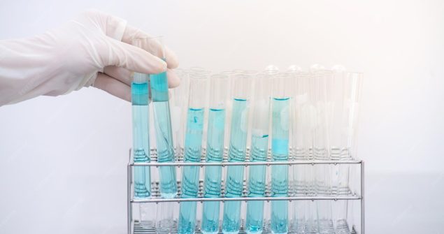 cropped-hand-scientist-wearing-surgical-glove-while-working-against-white-background_1048944-21448703